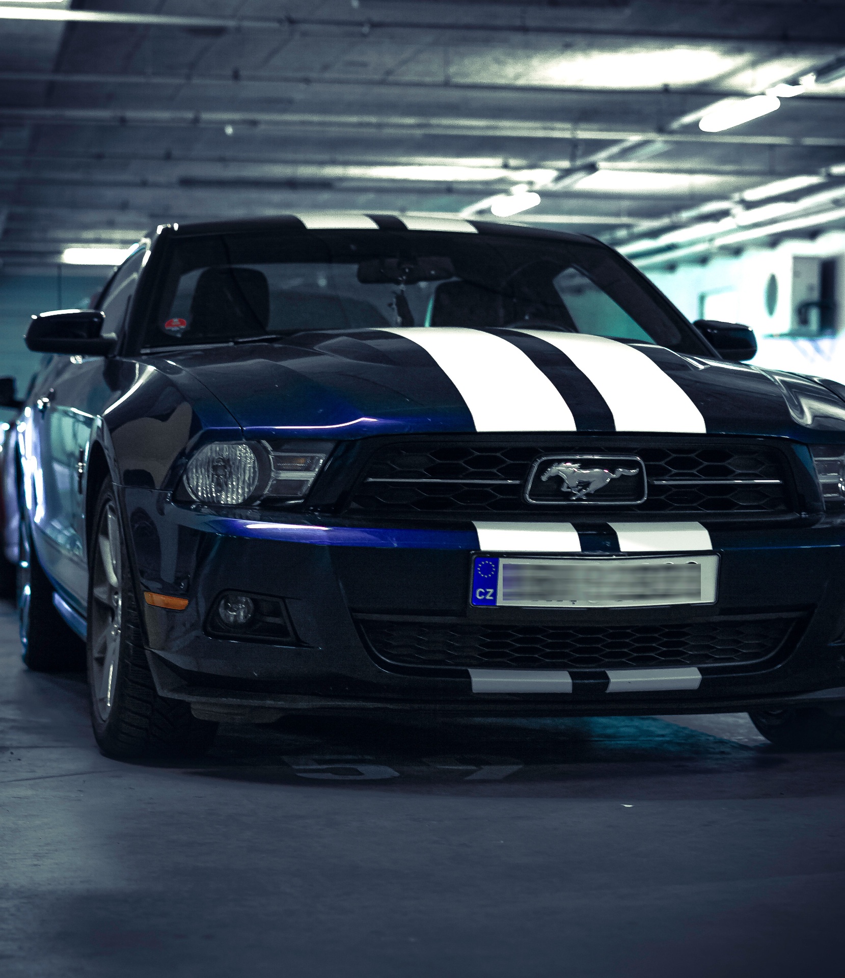 Blue Mustang with racing stripes